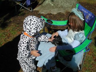 Scott and Katy in costume, holding a rabbit